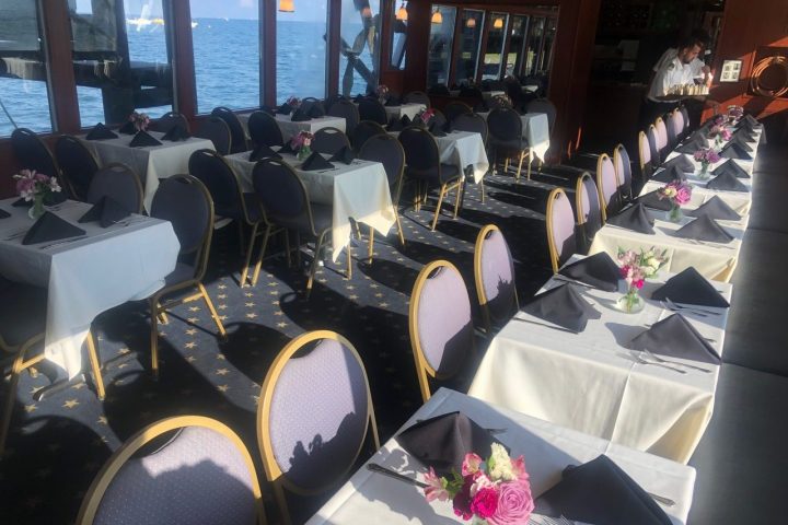 a group of people sitting at a table in a restaurant