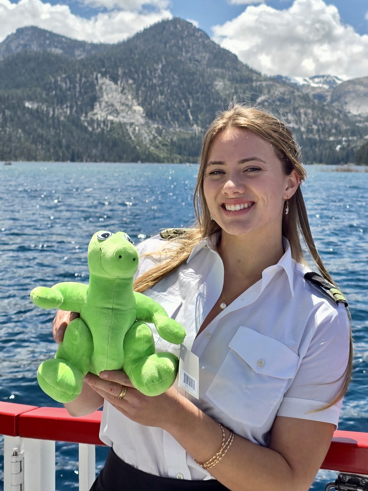 Tahoe Tessie with mountains and Lake Tahoe in the background.
